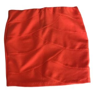 Orange mini skirt.
